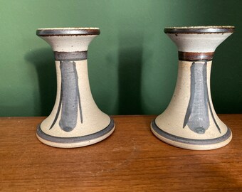 A pair of Scandinavian MCM pottery candlestick holders