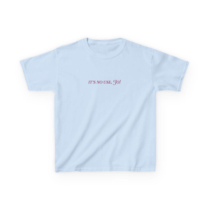 May include: A light blue t-shirt with the text "IT'S NO USE, GO!" printed in pink.