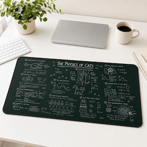 May include: A rectangular dark green desk mat featuring white line drawings and text titled The Physics of Cats. The design includes twelve numbered sections with scientific diagrams, equations, and cat illustrations explaining feline behaviors.