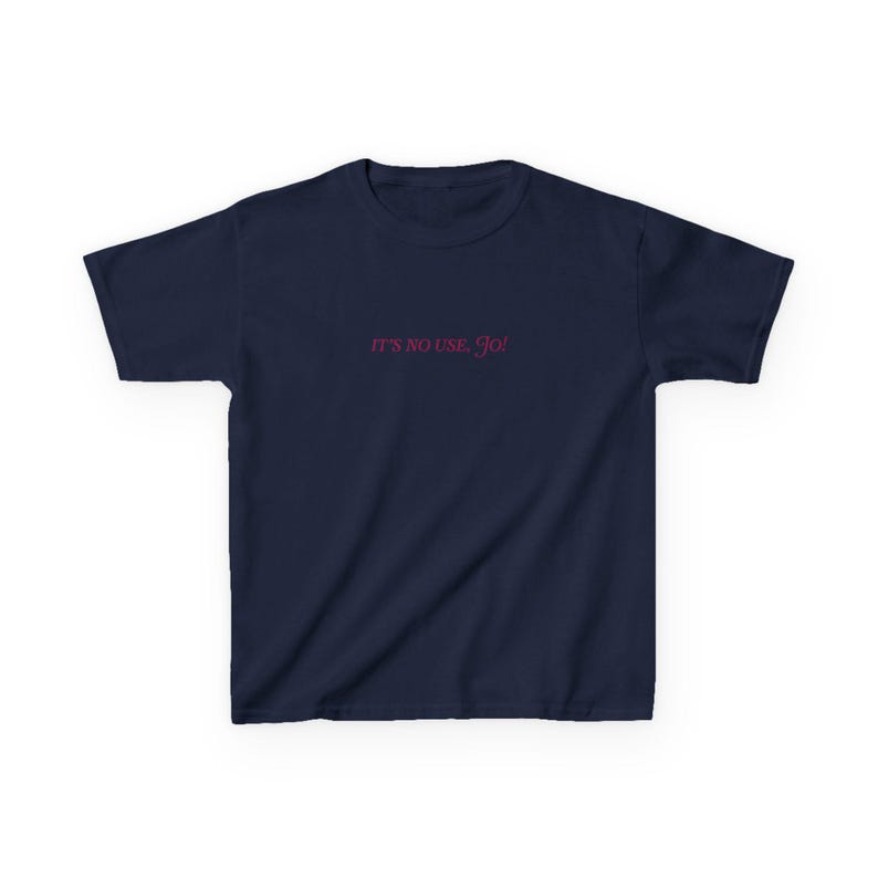May include: A navy blue t-shirt with the text "IT'S NO USE, Jo!" printed in pink.