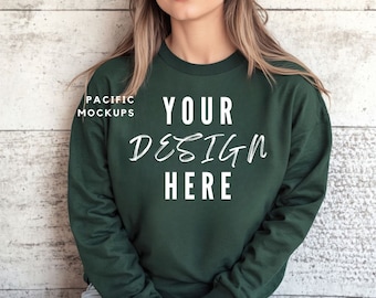 May include: A dark green sweatshirt with the text "YOUR DESIGN HERE" printed on the front.