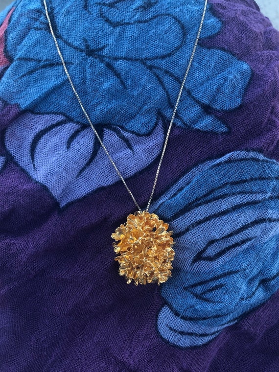 Gold plated flower pendant