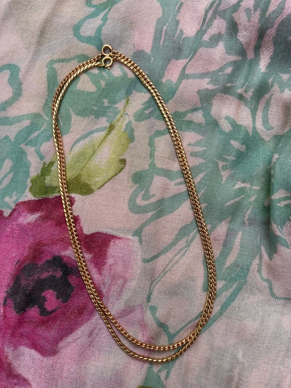 Double chain gold tone necklace.