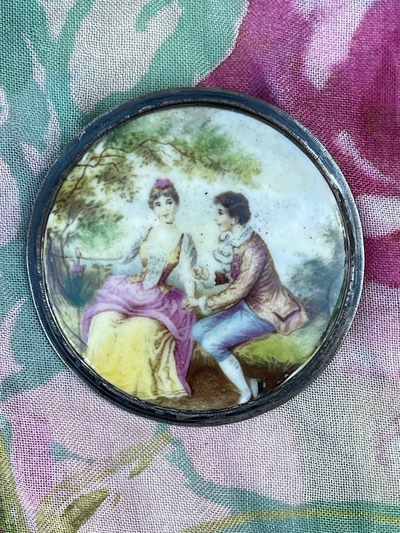 Hand painted man and lady broach. Sterling silver