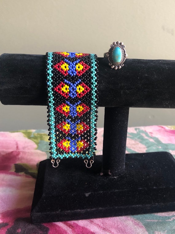 Hand beaded Navajo cuff and turquoise ring.