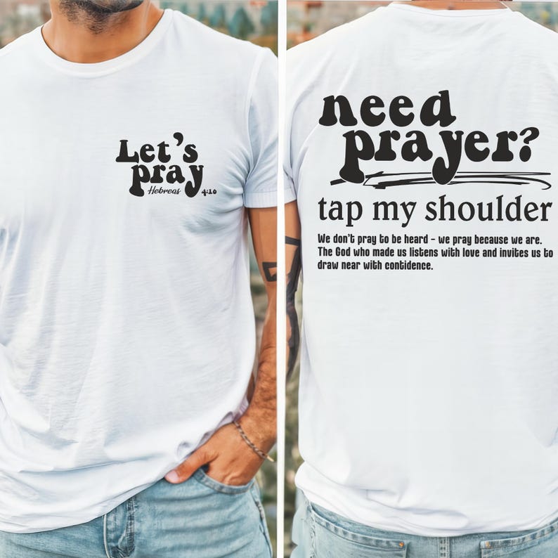 May include: White t-shirt with black text on the front and back. The front says "Let's pray" with "Hebrews 4:16" below. The back says "need prayer? tap my shoulder" with a short message below.