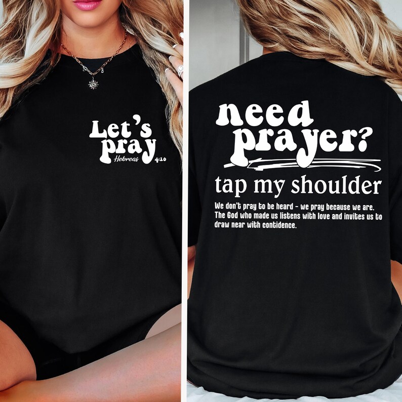 May include: Black t-shirt with white text. The front says "Let's Pray" with "Hebrews 4:10" below. The back says "need prayer? tap my shoulder" with a quote below. Religious apparel.