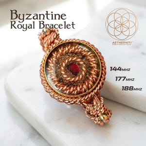 May include: A copper wire bracelet titled Byzantine Royal Bracelet featuring a central circular pendant with a dark red stone, coiled wire textures, and text reading AETHERNITI ENERGY HEALING TOOLS, 144MHZ, 177MHZ, and 188MHZ.