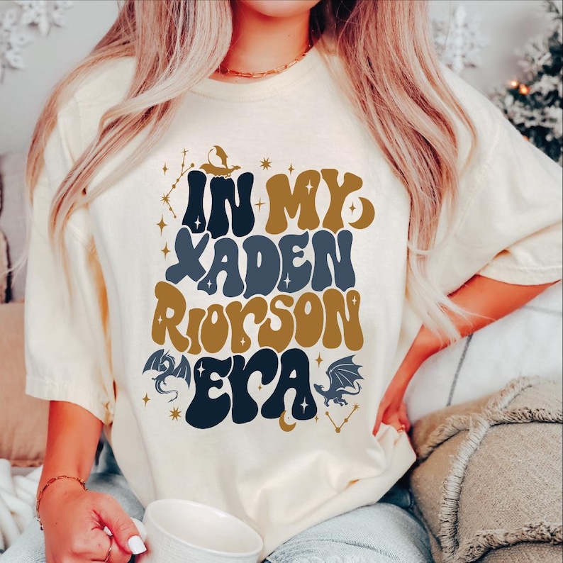 a woman sitting on a couch wearing a t - shirt with the words in my