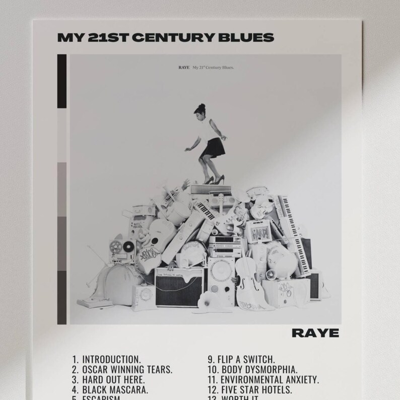 May include: Black and white poster with the text "MY 21ST CENTURY BLUES" and "RAYE". The image features a person standing on a pile of musical instruments and equipment. Below the image are song titles.