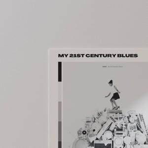 May include: A poster with the text "MY 21ST CENTURY BLUES" at the top. The poster features a black and white image of a person standing on a pile of electronic devices. The poster has a minimalist design with a color block on the left side.