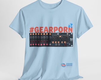 May include: Light blue t-shirt featuring a red hashtag that reads "#GEARPORn" and a black and white image of a Neve 8816 audio mixing console. The bottom right corner of the shirt has a logo that says "ZERO CROSSING RECORDS" in white text on a blue circle.