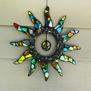 Rainbow sun .. blingthingzbylori.. black rainbow sun .. sun suncatcher.. whirligigs wind spinner.. garden art .. yard art .. autumn