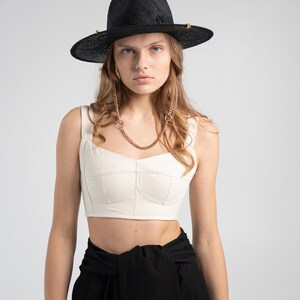 Printable corset pattern with detailed instructions, international sizing chart, and tips for adjusting underbust and waist, ideal for creating a custom corset top.