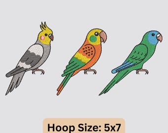 May include: Three embroidered parrots in a row, each with unique coloring. The first is gray, white, and yellow; the second is orange, yellow, and green; and the third is green and blue. The text "Hoop Size: 5x7" is at the bottom.