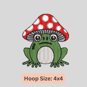 May include: Embroidered design of a green frog wearing a red and white mushroom cap. The design is suitable for a 4x4 inch embroidery hoop.