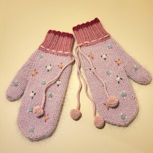 Knitted gloves with handmade embroidery. Warm and comfortable gloves.