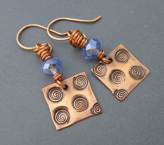Items similar to Spiral Stamped Copper Earrings with Faceted Blue