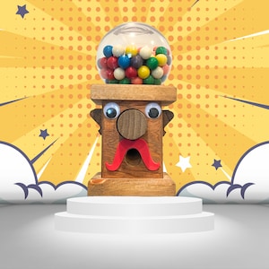 May include: A wooden gumball machine with a cartoon face. The machine has a clear plastic globe filled with colorful gumballs. The machine is on a white platform.