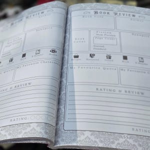 May include: Open notebook with book review pages. The pages have sections for book title, author, synopsis, and rating. There are also checkboxes for fiction/non-fiction, and icons for book, e-reader, and audio.