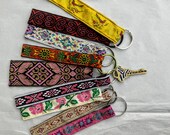 Fun little key chain, key fob, tribal floral bird jacquard ribbon zipper pull