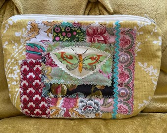Pretty yellow patchwork floral with a green butterfly zipper pouch