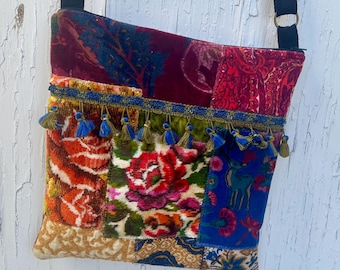 A bright mixed velvet in blues pinks greens and flowers patchwork zipper top crossbody bag