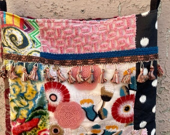 A fun mix of pinks, patterns and floral tapestry all come together in this one of a kind boho bag