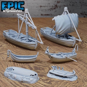 May include: Five miniature wooden boats, painted grey, on a wooden surface. The boats are various sizes and styles, including a rowing boat, a sailboat, and a dinghy. Some of the boats are damaged or broken.