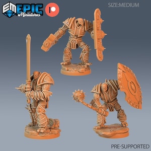 May include: Three orange-colored miniature figurines of armored warriors. One holds a sword, another a mace, and the third a shield. The figurines are on small bases. The text "PRE-SUPPORTED" is at the bottom.