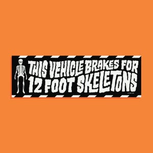 May include: Black and white bumper sticker with a skeleton and the text "This vehicle brakes for 12 foot skeletons".
