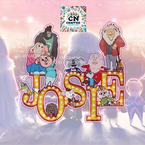 May include: A vibrant cake topper with characters from the film "Sing". The name "JOSE" is displayed in illuminated marquee letters. Animal characters are arranged around the letters, with the "CN CRAFTD CELEBRATIONS" logo visible in the background.