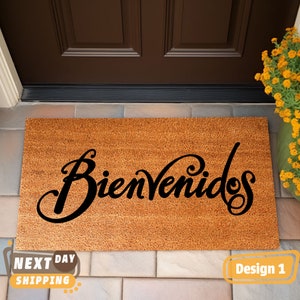 May include: A brown coir doormat with the word "Bienvenidos" in black cursive lettering.