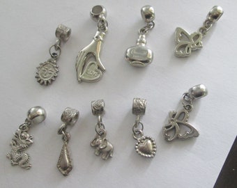 9 Silver and silvertone charm beads with wide loop bail destash