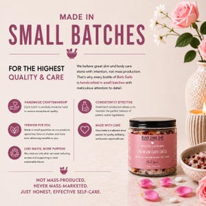 May include: A clear glass jar of Black Sand Labs Premium Bath Salts with a black lid, labeled 500g / 16.6oz. The jar contains pink and white salts with dried flower petals. Text on the jar includes 'Moisturise & Rejuvenate' and 'Floral Amour'.