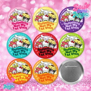 May include: A collection of eight circular pin-back buttons in various colors, each featuring a group of Sanrio characters and the text "Definitely Not 1st Visit". One button is shown from the back, revealing a silver metal pin mechanism.