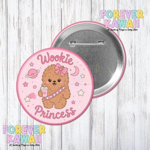 May include: A pink button with a cartoon Wookie character holding a drink, wearing a pink bow and a bandolier. The text "Wookie Princess" is written in pink script. The button has a silver back and the words "Forever Kawaii" are written on the image.