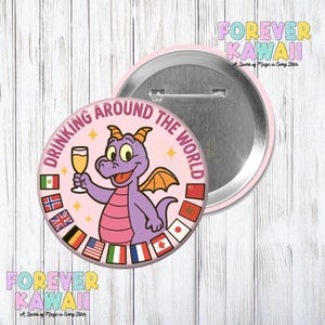 May include: A pink badge featuring a cartoon purple dragon holding a champagne glass, with flags and the text "DRINKING AROUND THE WORLD." The badge has a metal back and the words "FOREVER KAWAII" are printed on the image.