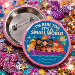 May include: A pink button badge with a metal pin. The badge features a blue design with the text "I'M HERE FOR IT'S A SMALL WORLD" and a cartoon illustration of children in a boat. The background is a mix of glitter and stars.