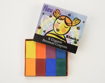 May include: A box of 8 organic beeswax crayons in a variety of colors, including yellow, orange, red, purple, blue, and green. The box features a cartoon bee with the text "8 Organic Beeswax Crayons" and "Blocks".