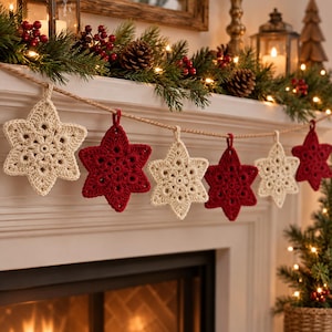 May include: A decorative garland featuring alternating cream and deep red crocheted star ornaments suspended from a thick, natural-colored jute twine. Each star displays a detailed, intricate floral-inspired pattern crafted with yarn.