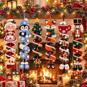 May include: Six crocheted Christmas ornaments hanging in a row. The figures include a grandmother, a penguin, a Christmas tree, a fox, a mug of hot cocoa, and a nutcracker. Each ornament features a long, spiraling tail in festive colors.