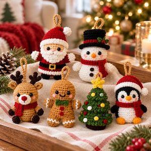 May include: A set of six crocheted Christmas ornaments featuring a Santa Claus, a snowman with a black top hat, a reindeer, a gingerbread person, a decorated Christmas tree, and a penguin, each with a small loop for hanging.