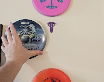 Appendiabiti da parete per disc golf