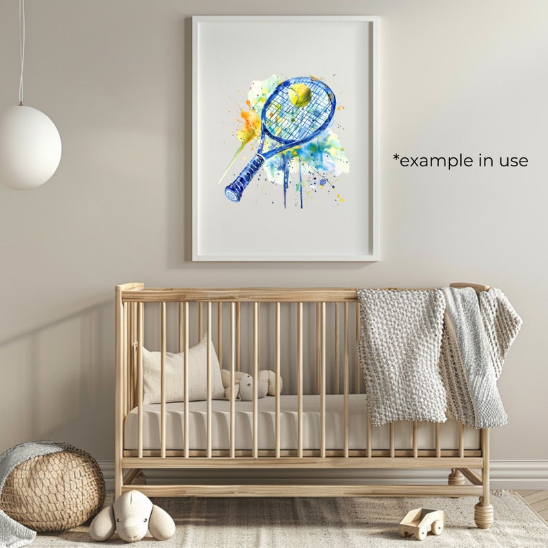 May include: A watercolour painting of a blue tennis racket with a yellow tennis ball. The painting has a splattered effect with blue, yellow, and green paint.