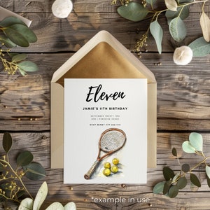 May include: A white invitation card with black text that reads "Eleven Jamie's 11th Birthday September Twenty Two SPM | Paradise Venue RSVP Mindy 777-222-1111". The card features a watercolour illustration of a tennis racket and tennis balls.