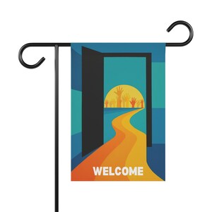 May include: A garden flag with a colorful design. The flag features an open door with a path leading to a sun with raised hands. The word "WELCOME" is printed at the bottom of the flag. The flag is attached to a black metal stand.