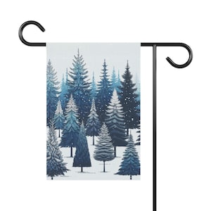 May include: A wintery garden flag with a blue and white design featuring a snowy forest of pine trees.