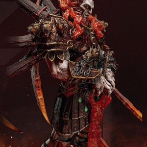 May include: A detailed statue of a warrior figure with a stern expression, clad in ornate armor with gold accents. The figure holds two swords and a large wooden weapon. The statue has fiery red hair and a fiery red sword. The text "ARES ZEZ STUDIOS" is visible.