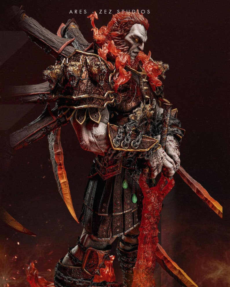 May include: A detailed statue of a warrior figure with a stern expression, clad in ornate armor with gold accents. The figure holds two swords and a large wooden weapon. The statue has fiery red hair and a fiery red sword. The text "ARES ZEZ STUDIOS" is visible.